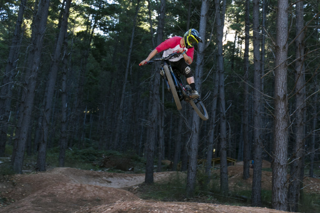 big jump on mountain bike in the forrest